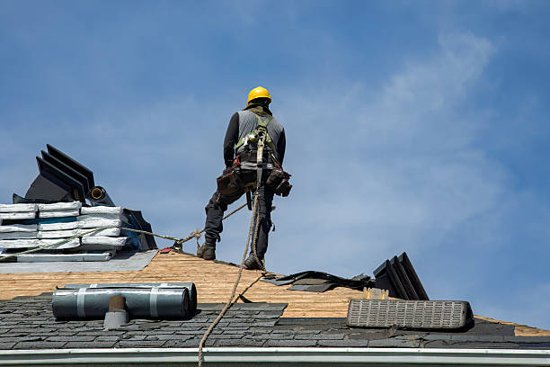 Professional Roofing technician working in East Norwich, NY
